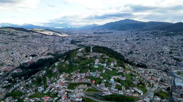 4k Ariel wide shot of Quito, Ecuador, and El Panecillo, Virgen de Legarda.