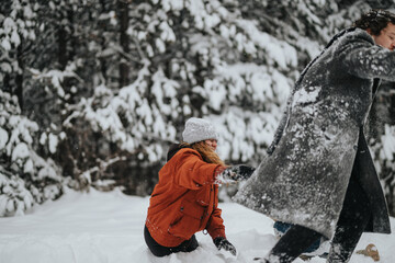 A cheerful outdoor scene depicting two individuals sharing a joyful day in a wintry forest setting,...