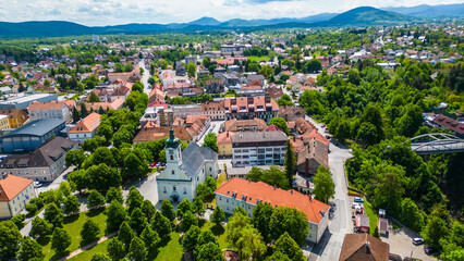 Ogulin, Croatia from the air &ndash; Heritage Museum, Hotel Frankopan, train station, Church of the Holy Cross and Klek mountain in the background. Historic charm meets natural beauty