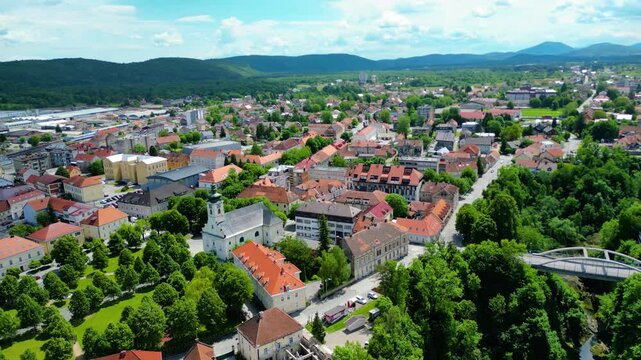 Ogulin, Croatia from the air &ndash; Heritage Museum, Hotel Frankopan, train station, Church of the Holy Cross and Klek mountain in the background. Historic charm meets natural beauty