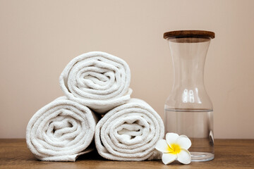 Spa treatment towel with tropical flower in spa solon. The concept of a serene atmosphere for relaxation and wellness.