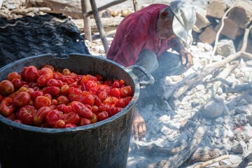 Traditional tomato cooking over open fire.
