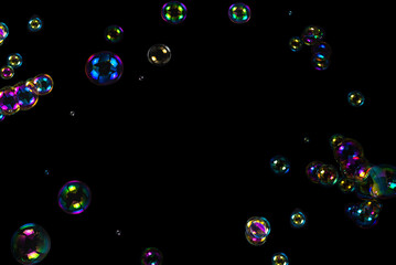Soap bubbles isolated on a black background.
