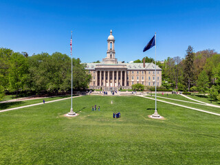 The Old Main building in the campus of Penn State University aerial view in spring sunny day, State College, Pennsylvania.