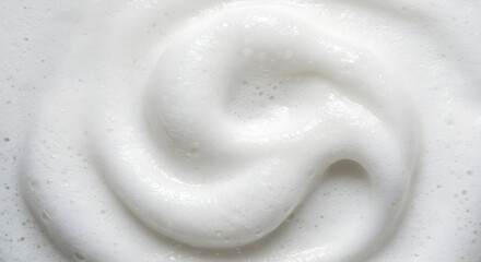 Close Up View Of White Foamy Lather With Swirling Pattern And Soft Texture