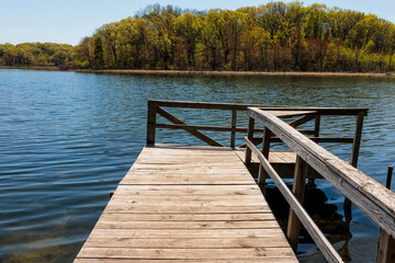 Naklejka premium The small boat pier on Ennis (Fountain) Lake within the John Muir Memorial Park, Montello, Wisconsin