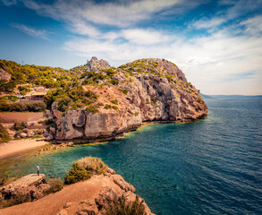 Obraz premium Sunny summer view of West Court of Heraion of Perachora, Limni Vouliagmenis location. Amazing morning seascape of Aegean sea, Greece, Europe. Traveling concept background.