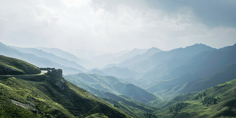 a scenic view of green hills and a winding road 