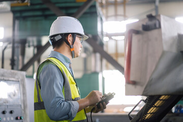 asian engineer operator cnc machine