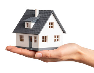 Close-Up of Hand Holding Tiny House Model, isolated on a transparent background.