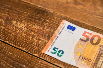 50 euro banknote on a wooden table
