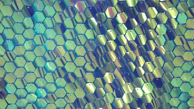 Shiny blue sequins in close-up. A photo zone made of sequins.