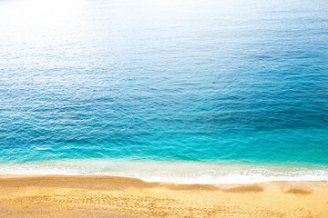 Top view of beautiful blue sea water with sand beach.