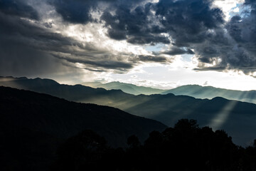 Early morning golden sunrise with clouds in the mountains of Nepal in Kutumsang, Helambu, Nuwakot
