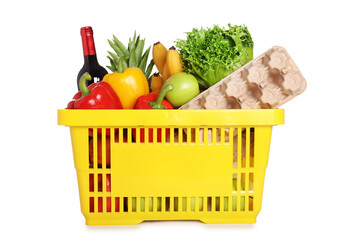 Shopping basket with different food products isolated on white