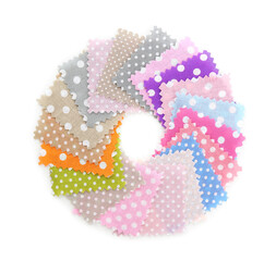 Samples of fabrics with polka dot pattern isolated on white, top view