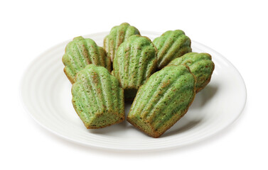 Tasty matcha madeleine cakes isolated on white