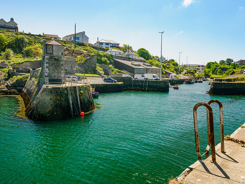 Port of Amlwch Anglesey. A dock with a railing and a ladder