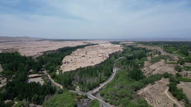 Turpan, China: Aerial drone footage of the ruins of the famous Jiaohe ancient city in Turpan that dates back to more than 2000 years in Turpan in China