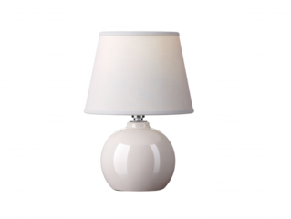 A white ceramic table lamp with a cone shaped lampshade is illuminated on a bright white background creating soft, ambient lighting in a clean presentation.