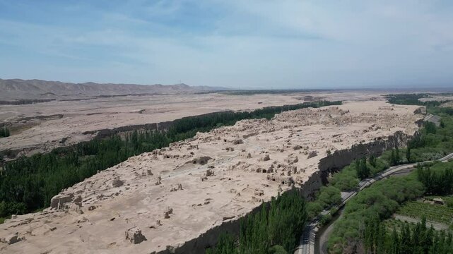 Turpan, China: Aerial drone footage of the ruins of the famous Jiaohe ancient city in Turpan that dates back to more than 2000 years in Turpan in China