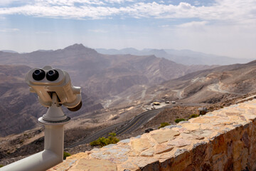 Most visited spot Jebel Jais scenic mountain landscape at Ras Al Khaimah, UAE. Breathtaking rocky peaks, winding roads, and popular tourist destination for hiking, camping, and zipline adventures