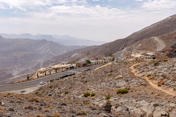 Most visited spot Jebel Jais scenic mountain landscape at Ras Al Khaimah, UAE. Breathtaking rocky peaks, winding roads, and popular tourist destination for hiking, camping, and zipline adventures