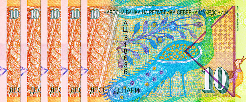 Fragment of the Banknote 10 denars Macedonia with a mosaic image of a peacock. Polymer money. Currency of Macedonia