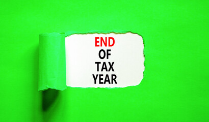 End of tax year symbol. Concept words phrase End of tax year on beautiful white paper. Beautiful...
