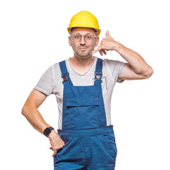 Call me, construction worker gesturing at speaking on phone while looking to camera, isolated on...