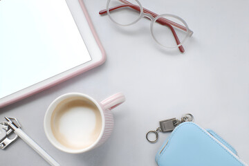 Minimalist Workspace Composition with Digital Tablet, Latte, and Stylish Eyeglasses on White Surface