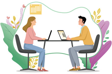 Two coworkers working at desk with laptop  
