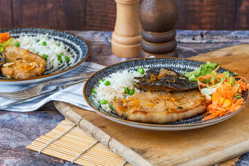 Orange glazed pork escalopes and portobello mushrooms with rice