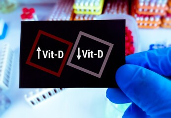Naklejka premium High (Toxic) and Low (Deficient) level of vitamin D conceptual image. vitamin D health concept