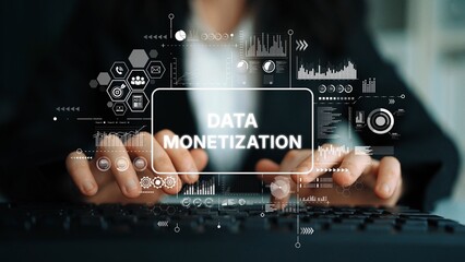 Business professional engaged in data monetization strategy with digital graphics and analytics overlay in an office environment. Asymptotic smart data analytic.