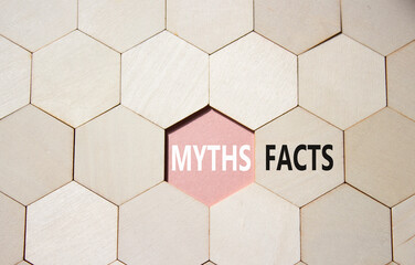 Facts or Myths symbol. Concept word Facts or Myths on wooden comb puzzle. Beautiful pink...