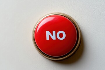 Bright red button with the word no displayed prominently against a neutral background in a office setting