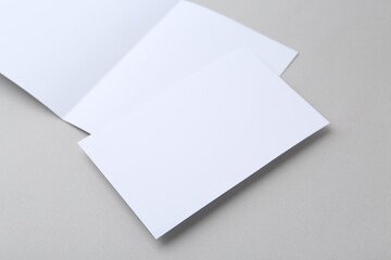 Blank greeting cards on light background, closeup