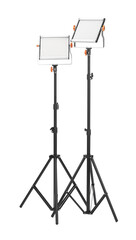 Professional lighting equipment with tripods isolated on white