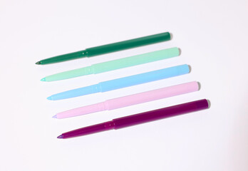 Colorful twist up eye pencils on white background