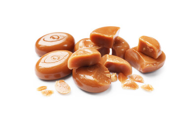 Broken tasty caramel candies isolated on white