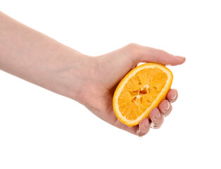 Woman squeezing orange on white background, closeup