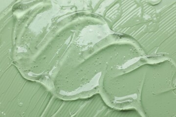 Collagen gel on green background, above view
