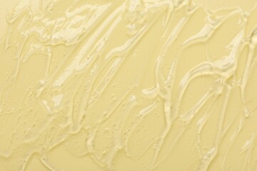 Collagen gel on yellow background, top view