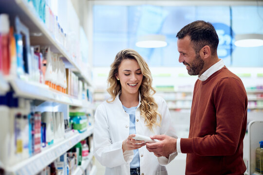 Pharmacist Assisting Customer in a Pharmacy with Friendly and Professional Interaction