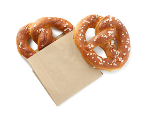 Tasty pretzels with salt isolated on white, top view