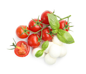 Tasty mozzarella cheese balls, tomatoes and basil isolated on white, top view