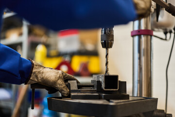 Close-Up of Metal Drilling in Workshop Using Drill Press