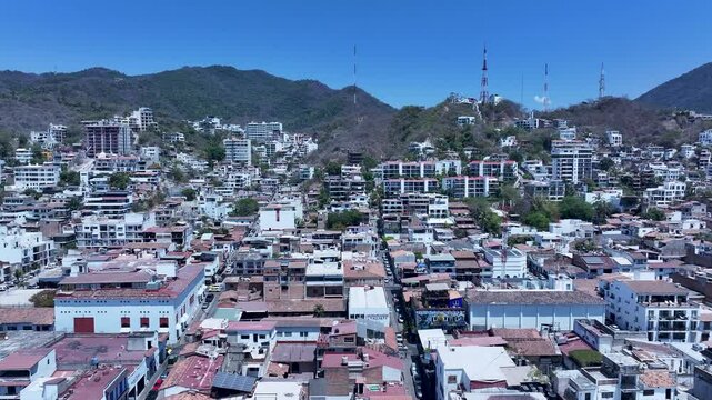 Aerial Mexico Puerto Vallarta Malecon buildings 1 slide . Mexican beach resort city on Pacific Ocean. International tourist destination. Tourism is the economic activity. Outdoor recreation. Vacation.