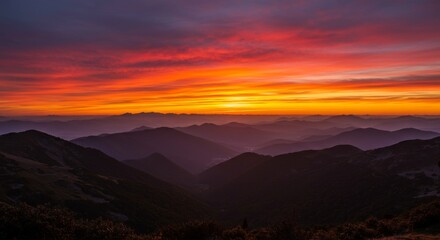 Obraz premium Majestic Mountain Sunset - Breathtaking sunset over a vast mountain range, vibrant colors paint the sky